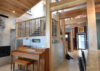 interior of stairway at mutli-wooden floored building with renderings