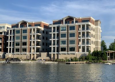 Lakeview shot of twin condo and apartment buildings on the lake.