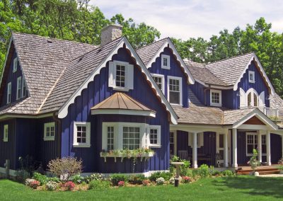 exterior shot of blue cottage lake house