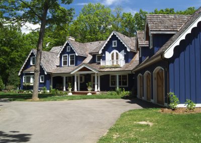 front view of blue cottage styled home